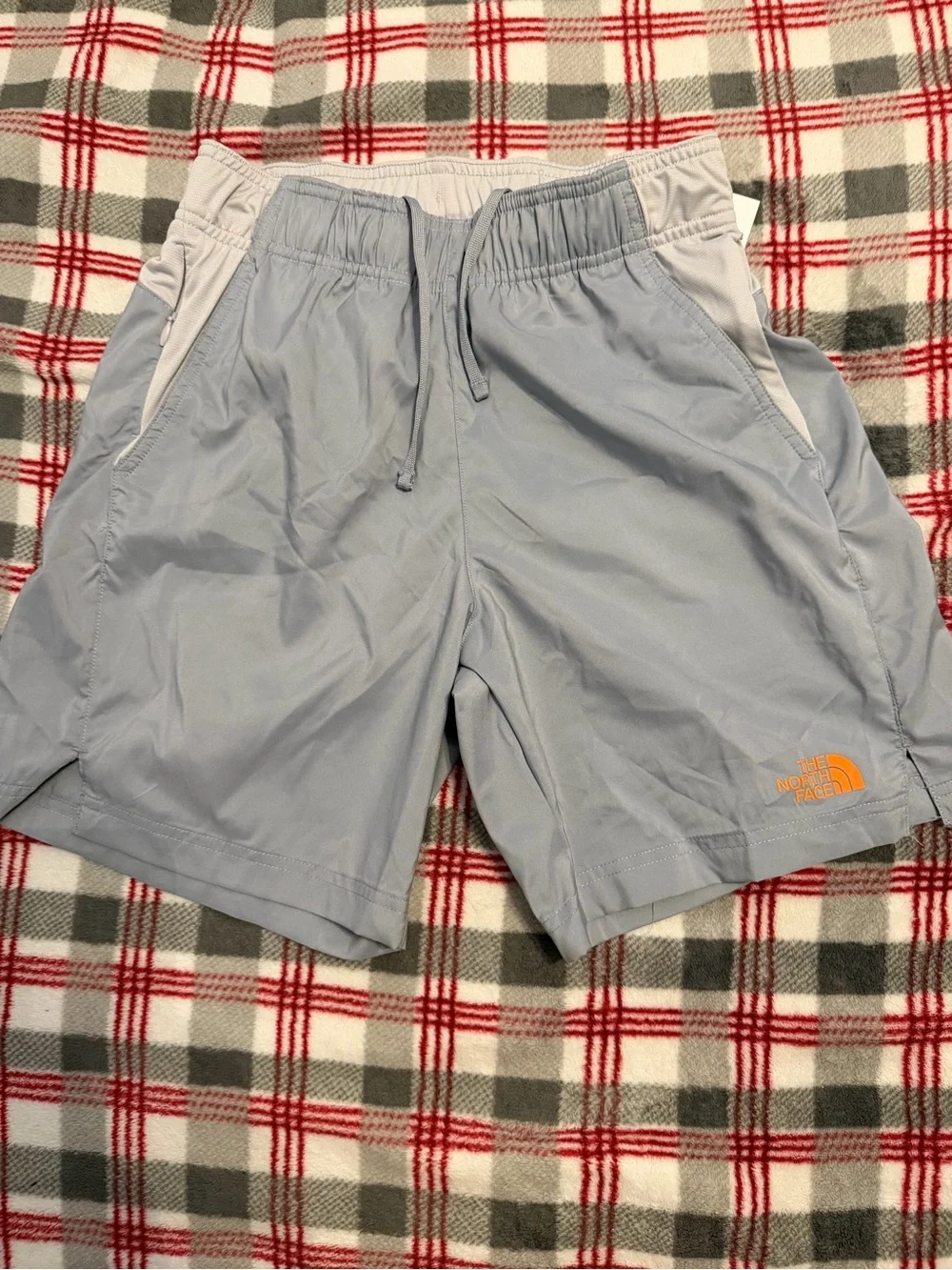 The North Face Men's Pale Blue Athletic Shorts with White Trim